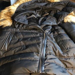 Cute Black, puffy Bebe coat.  Angle zipper.  Great shape! Worn a few times.